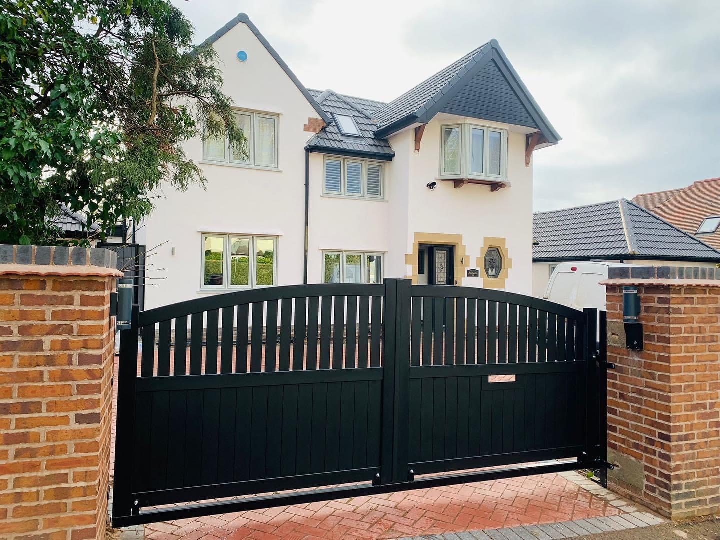 Arched gates and side gate on a rendered frontage, The Gate Factory near West Bromwich High Street, West Bromwich B70